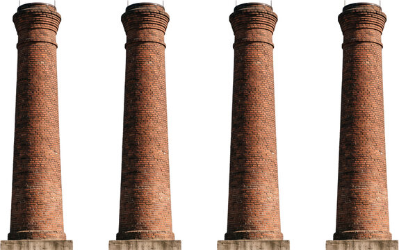 Four identical tall red brick industrial chimneys stand side by side showcasing weathered masonry architecture and classic cylindrical factory smokestack structures from historical times