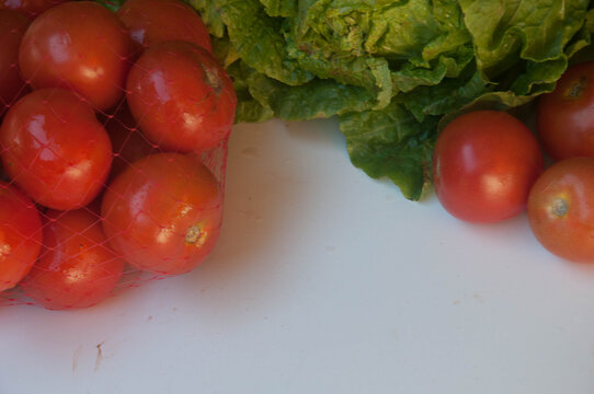 close-up of tomato and lettuce  .    Vegetables on a white background,