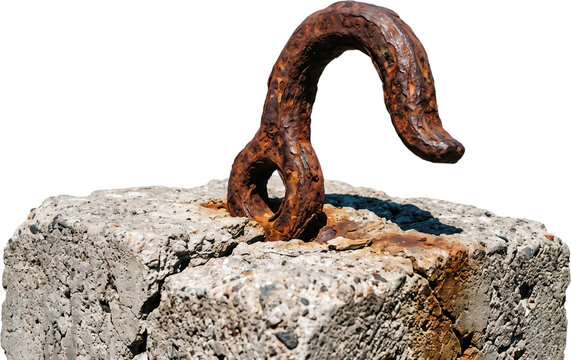 A heavy rusty metal hook securely embedded in a weathered grey concrete block showing signs of age and structural wear under bright daylight illumination rusty hook heavy weight