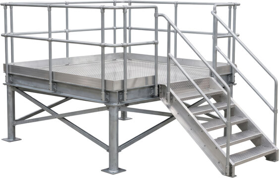 Industrial metal platform with safety stairs and handrails made from galvanized steel standing raised above the ground showcasing durable construction and architectural framework elements