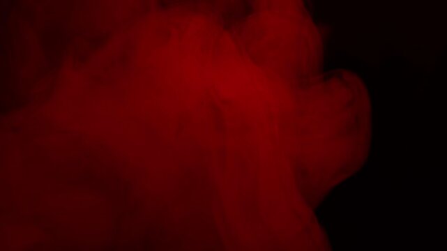 Real Red Smoke on Black Background