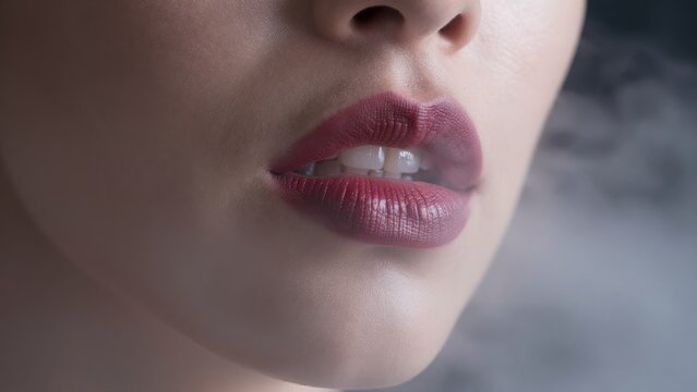 Close-Up of Woman's Lips Surrounded by Ethereal Smoky Atmosphere