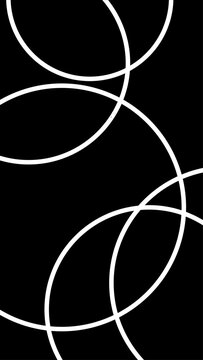Abstract pattern of overlapping white circular rings and curving lines on a dark background.