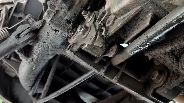 Leaking motorbike oil seeps into the bottom of the motorbike