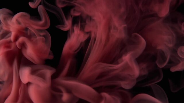 Extreme macro deep crimson vapor blooms outward with translucent smoke curls and subtle ruby highlights, creating a dramatic luxury cinematic background against black with generous negative copy space