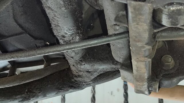 Leaking motorbike oil seeps into the bottom of the motorbike