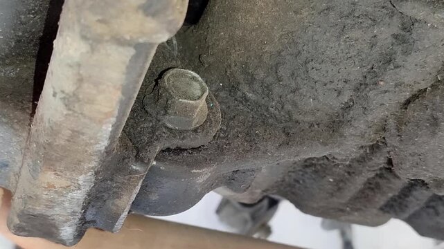 Leaking motorbike oil seeps into the bottom of the motorbike
