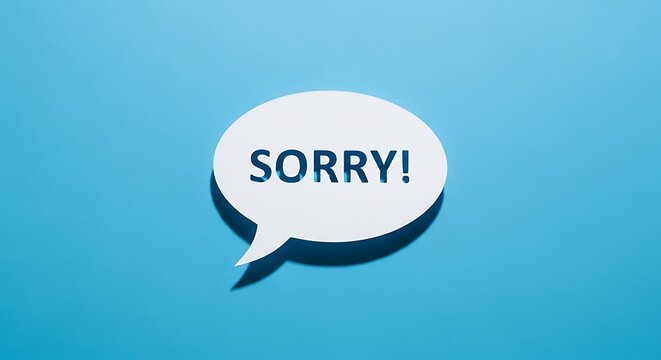 White speech bubble with the word sorry on a light blue background for apology concepts