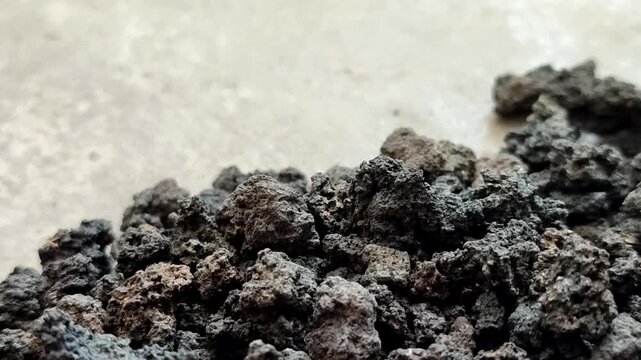 Black volcanic lava stone gravel, natural porous basalt rock texture for aquascape and gardening	