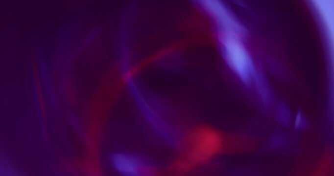 Defocused circles. Rainbow light. Purple neon red color optical gleam reflection on abstract bokeh bright illuminated art background.