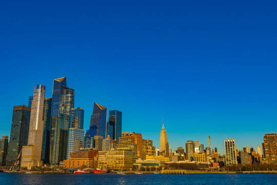 Bright skyline view of New York City under a clear blue sky