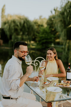 Sunset dining experience by the lake with delightful food and wine