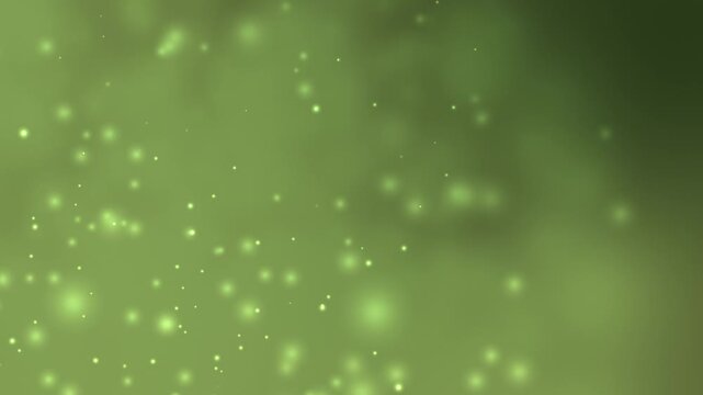 Gentle green light particles drift across blurred backdrop