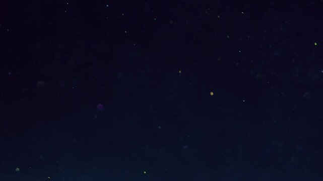 Floating stars overlay. Cosmic night texture. Defocused shiny ink blink circles overlay abstract background. Shimmering particles black space.