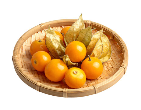 golden berry or Cape Gooseberries on a woven bamboo plate isolated on transparent png