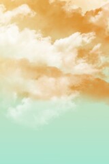 Dreamy golden clouds drift across a glowing sky, fading into a serene pastel turquoise horizon. © fika