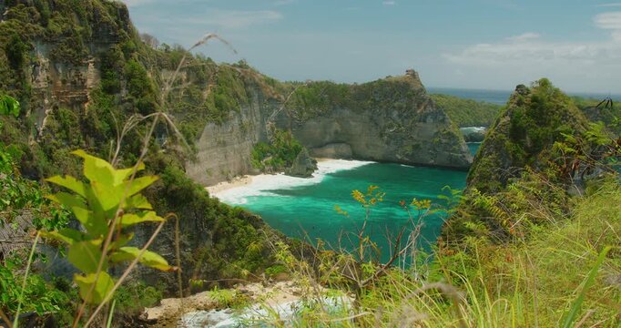 Scenic Diamond Beach view with turquoise ocean and tall limestone cliffs in Nusa Penida Bali Indonesia