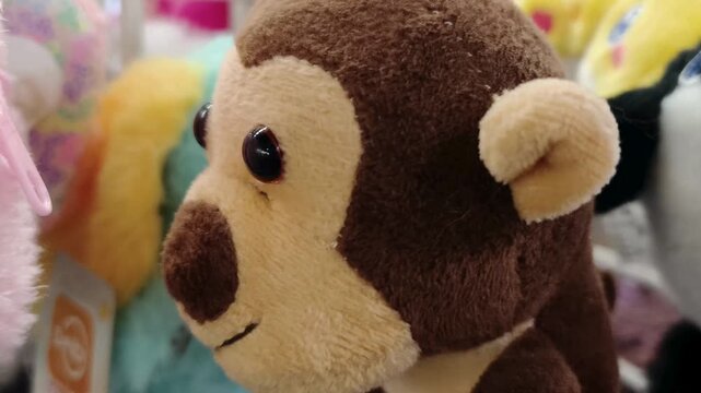 Cute brown monkey doll plush toy close up