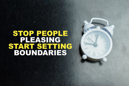 Concept of stop people pleasing start setting boundaries write on book isolated on table.
