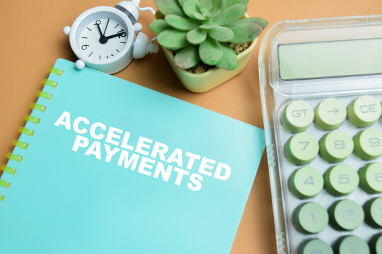 Concept of accelerated payments write on book isolated on table.