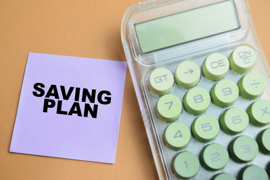 Concept of saving plan write on sticky notes isolated on table.