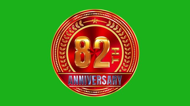 Radiant 82nd anniversary metallic gold wreath badge with reflective red ruby gemstone core and warm lighting on green screen 4k video