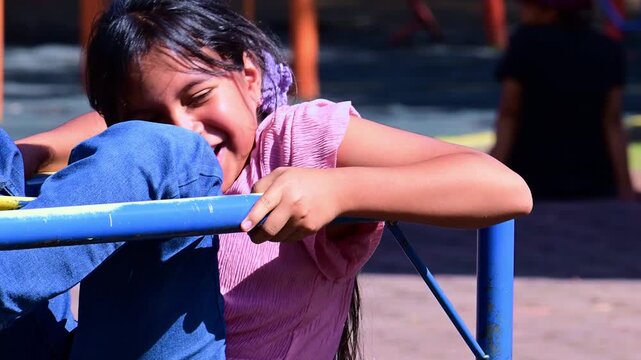 Girl screaming, stuck on a playground ride