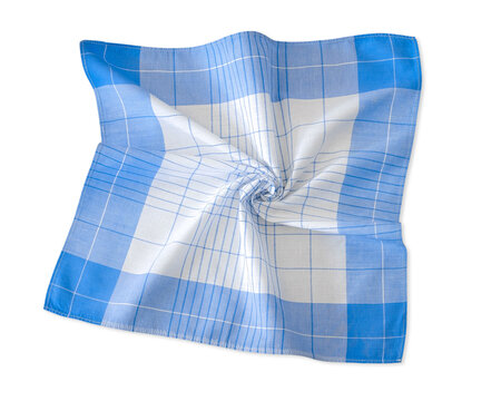 A light blue and white plaid men's cotton handkerchief artistically twisted in a spiral pattern isolated on a white background.
