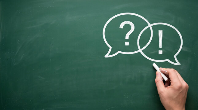 Question and answer concept. Hand drawing speech bubbles with question and exclamation marks with copy space