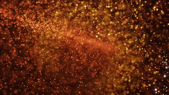 A mesmerizingly warm glow of golden particles swirling gracefully against a velvety brown background