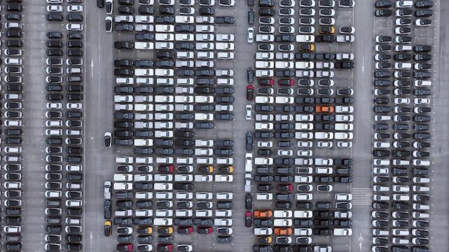 This EV car awaits shipping. Each EV car gets loaded. The EV car goes overseas.