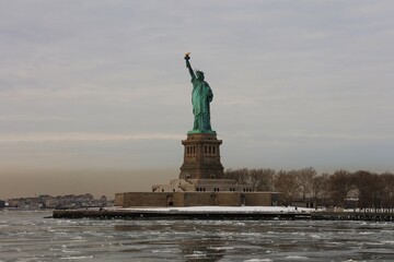 Statue of liberty from the water with ice floes, New York, USA  © Corinna