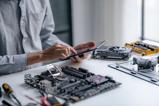 Computer repair technician specialist repairing and testing on Pc