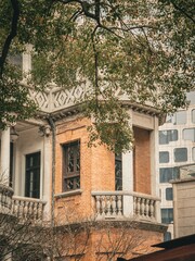 Historic brick corner turret framed by autumn foliage, Xintiandi, Shanghai © nhat.photograph