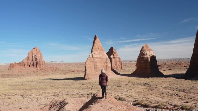 Cathedral Valley Overlook, Back View of Woman on Lookout in Capitol Reef National Park, Utah USA
