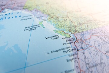 Fototapeta premium Map of Vancouver Island with flare from top right corner. Selective focus on label, close-up view