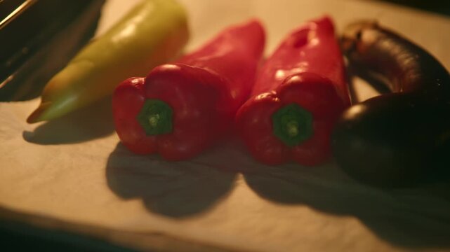 Fresh Bell Peppers And Eggplant Baking On Tray Inside Oven