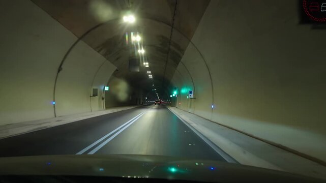 Car Driving Through Underground Highway Road Tunnel With Traffic Speed Limit Signs 