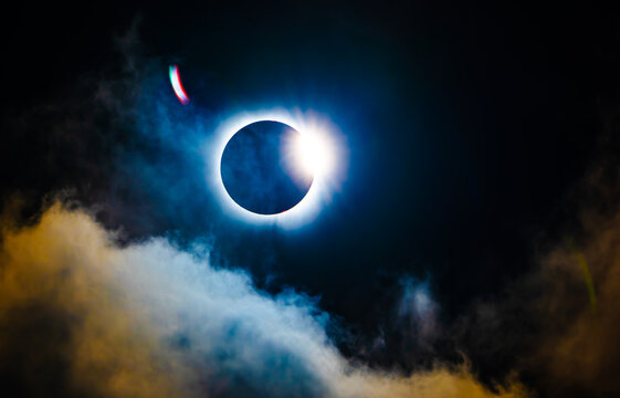Total solar eclipse corona and diamond ring in a dark sky