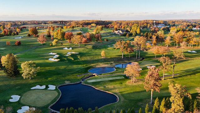 Aerial View of a Golf Course in Autumn with Colorful Fall Foliage in Greenville, Delaware