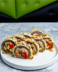 Plated crunchy fried sushi roll with almonds and tobiko © Cavan