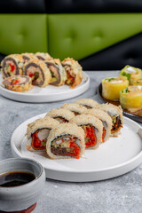 Various types of sushi rolls on a restaurant table © Cavan