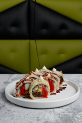 Soy sauce drizzled over specialty maki sushi rolls © Cavan