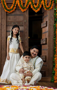 South Indian man with son and daughter 