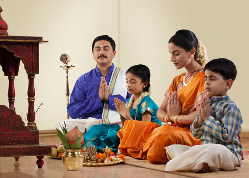 South Indian family praying 