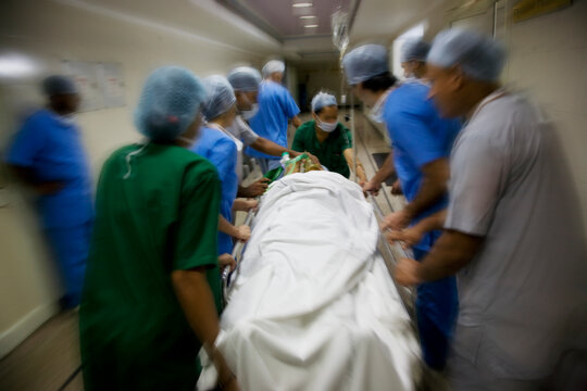 Surgeons rushing a patient to an operation theatre 