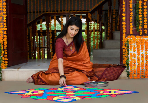 Woman making a rangoli 