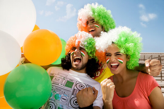Youngsters with wigs cheering 