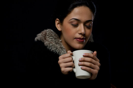 Girl enjoying a mug of tea 