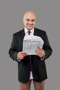 Bald businessman looking at some papers 